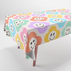 a colorful table cloth with smiley faces on it