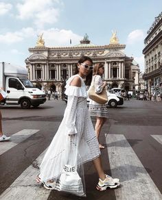 two women crossing the street in paris