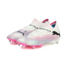 a white and pink soccer shoe with spikes