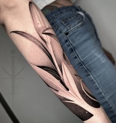 a person with a tattoo on their arm