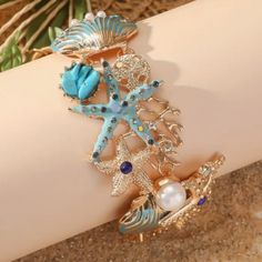 Ocean Beach Shell Wrist Or Ankle Bracelet. New Adjustable. Made With: Alloy, Rhinestones, Pearls. Toggle Clasp. Size: 8.25 Inches In Length. Strand Jewelry For Beach Party, Summer Bracelets With Starfish Charm, Beachy Jewelry For Beach Party, Starfish Charm Bracelets For Beach Season, Starfish Jewelry For Vacation, Coastal Style Jewelry For Summer Beach Parties, Coastal Style Jewelry For Beach Parties In Summer, Blue Summer Style Jewelry Gift, Summer Style Blue Jewelry Gift