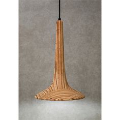 a wooden lamp hanging from a black cord