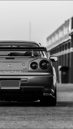 a black and white photo of a sports car