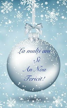 a silver christmas ornament with snowflakes on it and the words la mullicane si au nou ferci