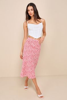 Your style will be making headlines when you style the Lulus Up and Coming Cutie Coral Pink Floral Print Midi Skirt! A backdrop of coral pink plays host to a ditsy floral pattern (in shades of light pink, ivory, and green), as it shapes this too-cute skirt with a high-waisted fit, a column silhouette, and a midi hem. Hidden side zipper/clasp. Fit: This garment fits true to size. Length: Mid-calf length. Size medium measures 30.5" from waist to hem. Waist: Fitted - elastic waist allows stretch. H Pink Skirt Outfits, Lulu Skirt, Ditsy Floral Pattern, Floral Print Midi Skirt, Lulu Fashion, Shades Of Light, Pink Ivory, Printed Midi Skirt, Pink Floral Print