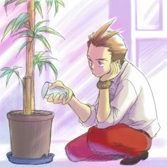 a man kneeling next to a potted plant with a cell phone in his hand