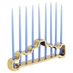 a hanukkah menorah with blue candles in it