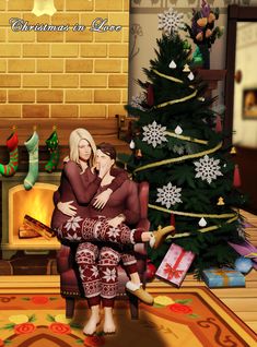 two people sitting on a chair in front of a christmas tree