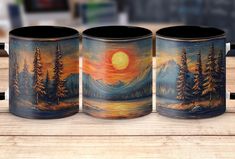 three coffee mugs sitting on top of a wooden table next to eachother