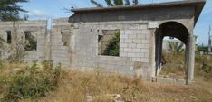 an old building that has been built into the side of it with no doors and windows