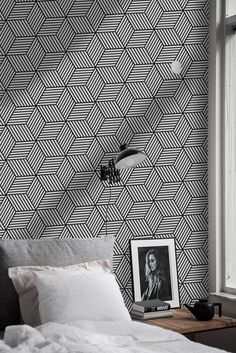 a black and white wallpaper in a bedroom