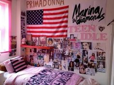 a bedroom with an american flag and pictures on the wall