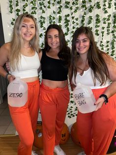 three young women standing next to each other