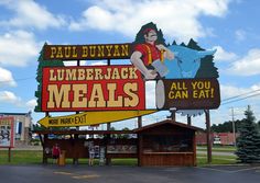 a large sign that says lumber jack meals all you can eat