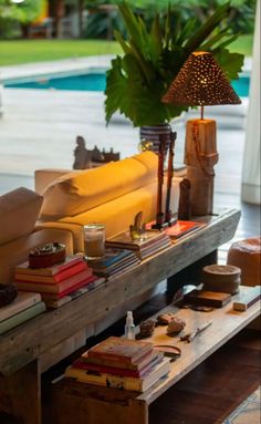 a living room filled with furniture next to a pool