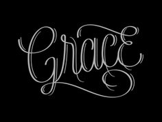 the word grace written in cursive writing on a black background with white ink