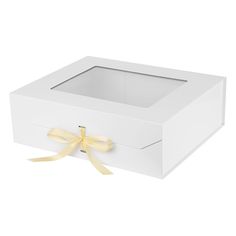 a white box with a yellow ribbon on the top and bottom, it is empty