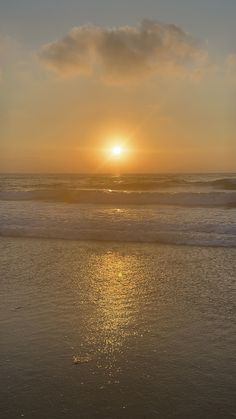 the sun is setting over the ocean with waves