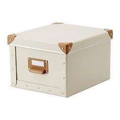 a white storage box with brown handles