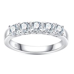 a white gold ring with five diamonds