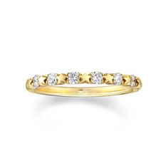 a yellow gold ring with five diamonds