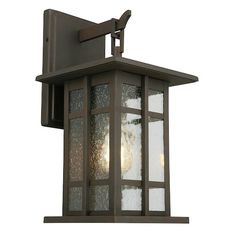 an outdoor wall light with frosted glass panels