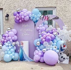 a frozen princess birthday party with balloons and decorations