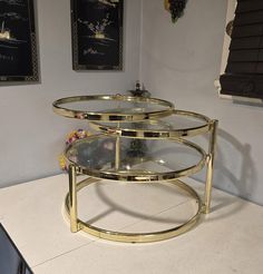 Vintage Brass Coffee Table. 3 Tiered, swivel Coffee Table, Brass Frame with 3 round glass table tops. All shelves are adjustable.  Fabulous Table, great for company, games, food  And absolutely stunning looking.  In Great vintage condition, No damages but There is some typical brass tarnishing, please see photos.(cost reflects this) Measurements will follow. Will be disassembled for shipping.  Please view my photos as I have added many as part of my description and feel free to message me with a Round Glass Table Top, Brass Coffee, Coffee Table Round, Table Home Decor, Vintage Coffee Table, Brass Coffee Table, Table Round, Coffee Table Vintage, Brass Table