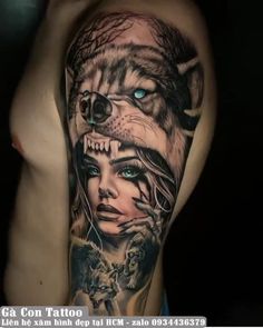 a woman with a wolf tattoo on her arm