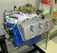 an engine is shown on display in a showroom for people to see and take pictures