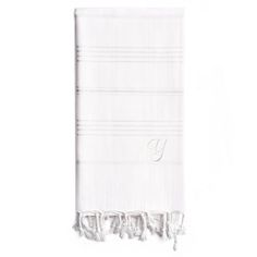 the monogrammed towel in white with fringes is shown against a white background