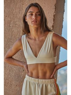 The Dealbreaker Brami is Knit Seamless Plunged V-Neck Sleeveless Bra Top. Wear this brami on its own or as a bra! FIT TIP: True to size FABRIC: 92% Nylon 8% Spandex CARE: Hand wash cold with like colors. Lay flat to dry Seamless V-neck Crop Top For Vacation, Stretch V-neck Crop Top For Vacation, Stretch V-neck Bra For Yoga, Stretch V-neck Yoga Bra, V-neck Crop Top With Built-in Bra For Beach, Comfortable V-neck Crop Top For Yoga, V-neck Crop Top, Bra Friendly For Yoga, V-neck Bra-friendly Crop Top For Yoga, Seamless Sports Bra For Beach