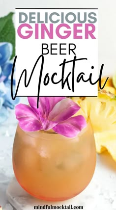 a drink with pink flowers in it and the words delicious ginger beer cocktail on top