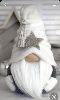 a close up of a gnome with a star on his hat