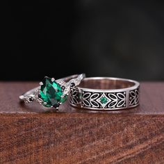 Here we have a Vintage Green Emerald Couples Ring Silver Ring Nature Inspired His and Hers Wedding Band Leaf Design Ring For Couples Anniversary Rings . ITEM DESCRIPTION ✦ Handmade, high-quality item! ✦ Material: Sterling Silver/10K/14K/18K/Platinum ►Sold as a two-piece set ►His ring is Sterling Silver with branch leaf design ►Center stone: 2mm Emerald ►His band width: 5mm ►Her ring is Sterling Silver.(can be made in 10/14/18k white/rose/yellow/black gold) ►Center stone: 6x8mm pear cut lab emera Vintage Emerald Rings For Wedding, Silver Stackable Emerald Cut Rings For Wedding, Silver Emerald Ring With Diamond Cut For Wedding, Green Stackable Wedding Rings Fine Jewelry, Emerald Cut Stackable Emerald Rings For Wedding, Wedding Stackable Emerald Rings With Emerald Cut, Heirloom Style Emerald Ring For Wedding, Green Birthstone Stackable Rings For Wedding, Fine Jewelry Engraved Birthstone Ring For Wedding