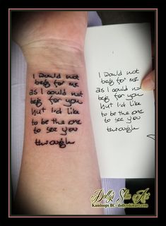 a woman's arm with a poem written on it