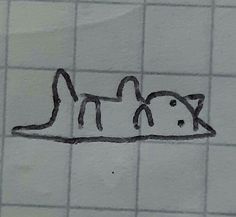 a drawing of a cat on a tiled wall