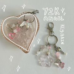 two key chains with charms attached to them