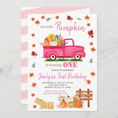 a pink truck with pumpkins on the back