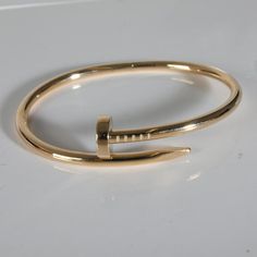 Cartier Juste Un Clou Bracelet (Yellow Gold)   PRIMARY DETAILS   SKU: 139371   Listing Title: Cartier Juste Un Clou Bracelet (Yellow Gold)   Condition Description: Translating to 'just a nail', the Juste Un Clou collection from Cartier is one of the Maison's most celebrated styles. The collection was born in the '70s and represented the brand's edgier side and flair for unique design.       Retails for 8000 USD. In excellent condition. 17 cm in length. Comes with Box;Certificate of Authenticity;Original Receipt;Service Papers;Papers;   Brand: Cartier   Collection/Series: Juste Un Clou   Metal Type: Yellow Gold   Metal Purity: 18k   Chain or Bracelet Length (in): 17   Pre-Owned Jewelry Condition: Excellent   SIDE STONE INFORMATION   Original Box?: Yes   Original Papers?: Yes   This item has Gold Cartier Bracelet, Cartier Nail Bracelet, Cartier Juste Un Clou Bracelet, Juste Un Clou Bracelet, Cartier Juste Un Clou, Nail Bracelet, Cartier Bracelet, Indie Jewelry, Wrap Bracelets