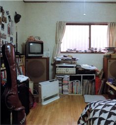 a living room filled with furniture and a tv