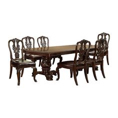 a dining room table and chairs with brown leather upholstered seat covers on the side