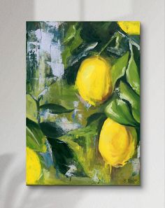 a painting of lemons hanging on a wall