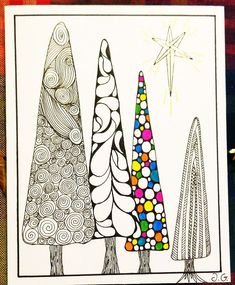 a card with three christmas trees on it