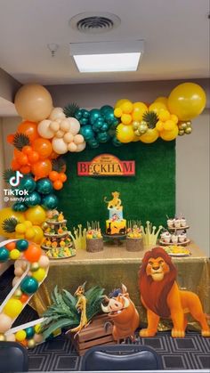 a lion themed birthday party with balloons and decorations