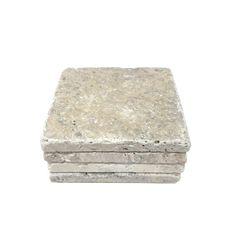 three square stone blocks stacked on top of each other, one is white and the other is gray