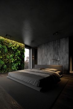 a bedroom with a large bed in front of a green wall and floor to ceiling windows