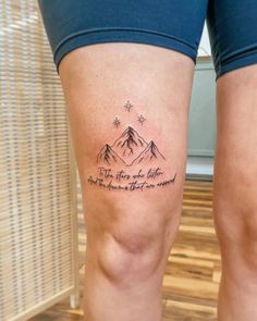 a woman's legs with a tattoo saying, there is no place like home