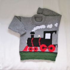 a sweater with a train drawn on it