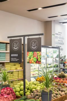 a display in a grocery store filled with lots of fresh fruits and veggies